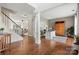 Open home office with hardwood floors, large window, and custom cabinet at 8929 Lizzie Ln, Huntersville, NC 28078