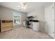 Home office with lots of natural light, neutral carpeting and built-in desk at 8929 Lizzie Ln, Huntersville, NC 28078
