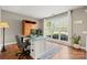 Bright home office with a large window, hardwood floors, and built in cabinet at 8929 Lizzie Ln, Huntersville, NC 28078