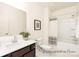 Bright bathroom features a modern vanity, framed mirror, and tub-shower combination at 908 Cypress Point Ln # 218, Monroe, NC 28112