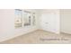 Cozy bedroom with plush carpeting, ample sunlight from windows, and a closet with white paneled doors at 908 Cypress Point Ln # 218, Monroe, NC 28112