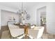 Sophisticated dining area with seating for six, a modern chandelier and tasteful decor at 908 Cypress Point Ln # 218, Monroe, NC 28112