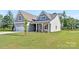 Attractive home with a landscaped lawn and a welcoming porch, offering curb appeal and charm at 908 Cypress Point Ln # 218, Monroe, NC 28112