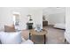 Bright living room with access to a sunroom, featuring neutral tones and an open layout at 908 Cypress Point Ln # 218, Monroe, NC 28112