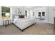 Spacious main bedroom with large windows, neutral tones, and ample natural light at 908 Cypress Point Ln # 218, Monroe, NC 28112