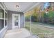 Covered patio with view of lush backyard, offering a serene outdoor space at 908 Cypress Point Ln # 218, Monroe, NC 28112