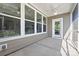 A screened-in porch with white ceiling fans and multiple sliding glass windows at 908 Cypress Point Ln # 218, Monroe, NC 28112