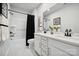 Stylish bathroom featuring dual sinks, quartz countertops, and a modern shower with matte black hardware at 920 Exeter Dr, Sherrills Ford, NC 28673