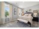 Bright bedroom with two large windows, neutral walls, carpet, and light-colored furniture at 920 Exeter Dr, Sherrills Ford, NC 28673