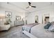 Spacious bedroom with neutral walls, furniture, a ceiling fan, and carpet with views into ensuite bathroom at 920 Exeter Dr, Sherrills Ford, NC 28673