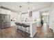 Bright kitchen featuring an island with barstool seating, white cabinets, and modern pendant lighting at 920 Exeter Dr, Sherrills Ford, NC 28673