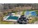 Aerial view showcasing the community pool, playground, and tennis courts at 9508 Hayenridge Ct, Huntersville, NC 28078