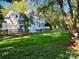 Expansive backyard with a well-maintained lawn, patio, wooden deck, and privacy fence at 9508 Hayenridge Ct, Huntersville, NC 28078