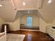 Bedroom featuring vaulted ceiling, hardwood floors, recessed lights, and a cozy window nook with storage at 9508 Hayenridge Ct, Huntersville, NC 28078