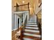 Welcoming two-story foyer with hardwood floors and staircase with iron balusters provides an elegant entry at 9508 Hayenridge Ct, Huntersville, NC 28078