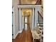 Spacious foyer with hardwood floors, decorative pillars, and staircase, offering a grand entrance at 9508 Hayenridge Ct, Huntersville, NC 28078