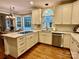 Well-appointed kitchen with white cabinets, quartz countertops, and modern stainless steel appliances at 9508 Hayenridge Ct, Huntersville, NC 28078