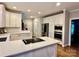 Modern kitchen with white countertops, stainless steel appliances, and a stylish backsplash at 9508 Hayenridge Ct, Huntersville, NC 28078