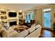 Cozy living room with fireplace, built-in shelving, and ample seating provides a comfortable space at 9508 Hayenridge Ct, Huntersville, NC 28078