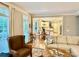 Bright and airy living room showcasing wood floors and an open layout to the kitchen and dining area at 9508 Hayenridge Ct, Huntersville, NC 28078