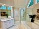 Bright and spacious main bathroom featuring tiled floors, a glass enclosed shower, granite countertops, and a soaking tub at 9508 Hayenridge Ct, Huntersville, NC 28078