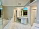 Luxurious bathroom featuring marble floors, granite countertops, a soaking tub, separate toilet, and a glass door shower at 9508 Hayenridge Ct, Huntersville, NC 28078