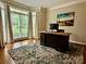 Well-lit office featuring a large desk and big windows, perfect for a productive workspace at 9508 Hayenridge Ct, Huntersville, NC 28078