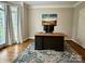 Bright and airy office with an oversized desk, neutral paint, and ample natural light at 9508 Hayenridge Ct, Huntersville, NC 28078