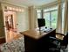 Inviting office area featuring a spacious desk and large window with abundant natural light at 9508 Hayenridge Ct, Huntersville, NC 28078