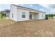 Exterior showcasing a spacious backyard with a covered patio, perfect for outdoor entertaining and relaxation at 105 Tanner Loop, Troutman, NC 28166