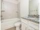 Clean and functional bathroom with tiled shower, white vanity with granite countertop, and modern fixtures at 105 Tanner Loop, Troutman, NC 28166