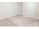 New carpet flooring, clean baseboards, and neutral walls fill this bedroom at 105 Tanner Loop, Troutman, NC 28166