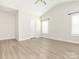 Light-filled bedroom with modern ceiling fan and windows at 105 Tanner Loop, Troutman, NC 28166