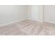 New carpet flooring, clean baseboards, and neutral walls fill this bedroom at 105 Tanner Loop, Troutman, NC 28166