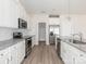 Modern kitchen featuring stainless steel appliances and granite countertops, perfect for cooking and entertaining at 105 Tanner Loop, Troutman, NC 28166