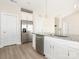 Modern kitchen featuring stainless steel appliances, granite countertops, and white cabinetry at 105 Tanner Loop, Troutman, NC 28166