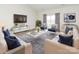 Bright living room with contemporary furnishings, decor, and ample natural light at 105 Tanner Loop, Troutman, NC 28166