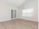 Open living room featuring french doors and large windows at 105 Tanner Loop, Troutman, NC 28166