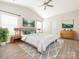 Serene primary bedroom featuring a high ceiling, natural light, and comfortable layout with stylish decor at 105 Tanner Loop, Troutman, NC 28166