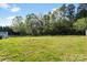 Expansive backyard provides ample space for recreation and outdoor enjoyment, bordered by mature trees at 1058 Canada Dr, Dallas, NC 28034