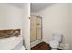 Bathroom showcasing a modern shower and a soaking tub with tile surround for a spa-like experience at 1058 Canada Dr, Dallas, NC 28034