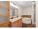 Modern bathroom features a double vanity, soaking tub with stylish tile accents, and a separate glass-enclosed shower at 1058 Canada Dr, Dallas, NC 28034
