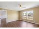 Bedroom with new hardwood flooring, neutral paint, ceiling fan, and a double window at 1058 Canada Dr, Dallas, NC 28034