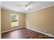 Bedroom with new hardwood flooring and window view at 1058 Canada Dr, Dallas, NC 28034