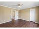 Bedroom features hardwood floors, neutral paint, and two closet doors at 1058 Canada Dr, Dallas, NC 28034