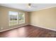 Bedroom featuring two large windows and hardwood flooring at 1058 Canada Dr, Dallas, NC 28034