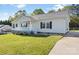 Charming single-story home with a well-maintained lawn and inviting front porch at 1058 Canada Dr, Dallas, NC 28034