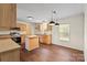 Eat-in kitchen features wood cabinets, modern appliances, and a kitchen island at 1058 Canada Dr, Dallas, NC 28034