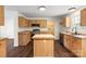Kitchen features a center island, wood cabinets and flooring at 1058 Canada Dr, Dallas, NC 28034