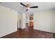 Inviting living room with hardwood floors, a ceiling fan, and access to other rooms at 1058 Canada Dr, Dallas, NC 28034